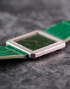 Low-angle view highlighting the sharp corners and striped bezel of the Piaget Protocole 9154.