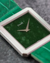 Close-up of the natural green jade dial, dauphine hands and striped white gold bezel.