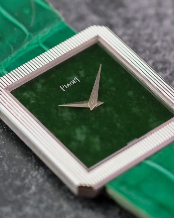 Close-up of the natural green jade dial, dauphine hands and striped white gold bezel.