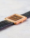 Crown-side profile of the Piaget Protocole Ref. 9154 with its 18K yellow gold case and black original strap.