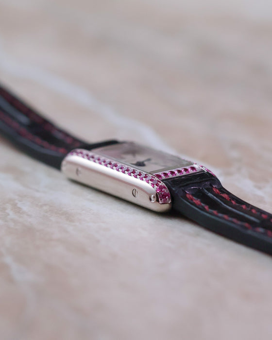 Opposite side profile showing the slim construction and gemstone setting of the Cartier Tank Allongée.