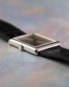 Angled view of the Piaget Ref. 9150 showing its silver dial, dauphine hands and rectangular white gold case.