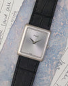Angled front view of the Piaget Ref. 9150 showing its silver dial and compact rectangular proportions.