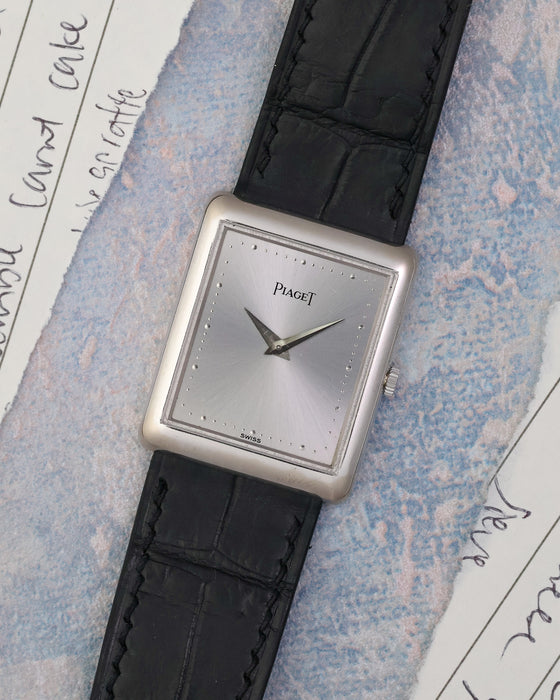 Angled front view of the Piaget Ref. 9150 showing its silver dial and compact rectangular proportions.