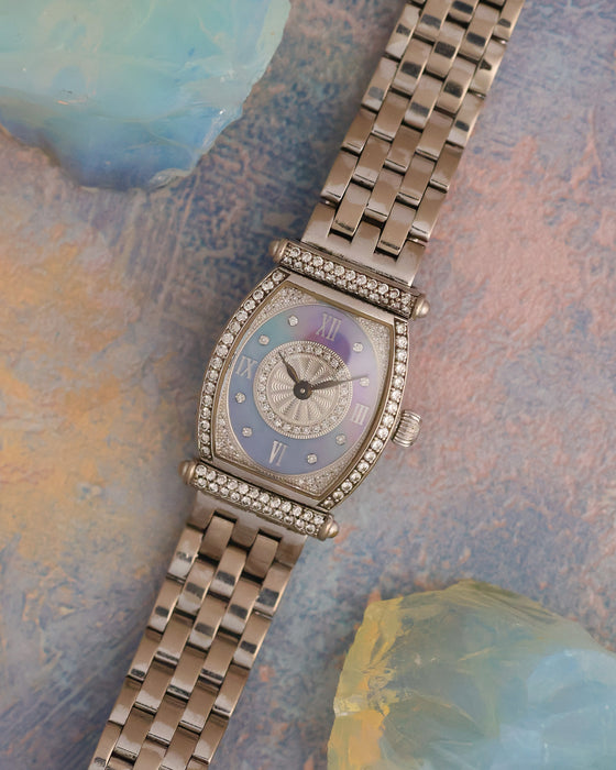 Audemars Piguet Carnegie in 18K white gold with factory diamond setting, blue mother-of-pearl dial and integrated white gold bracelet.