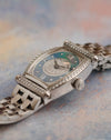 Angled view of the diamond-set Audemars Piguet Carnegie showing its curved tonneau case, mother-of-pearl dial and white gold bracelet.