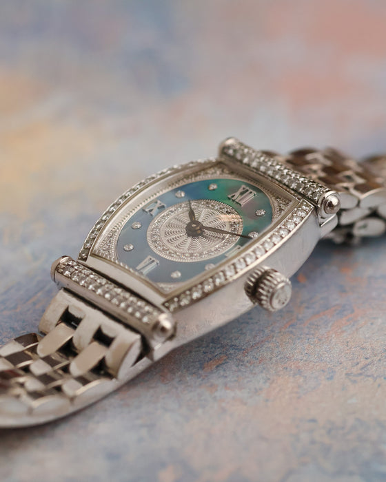 Angled view of the diamond-set Audemars Piguet Carnegie showing its curved tonneau case, mother-of-pearl dial and white gold bracelet.