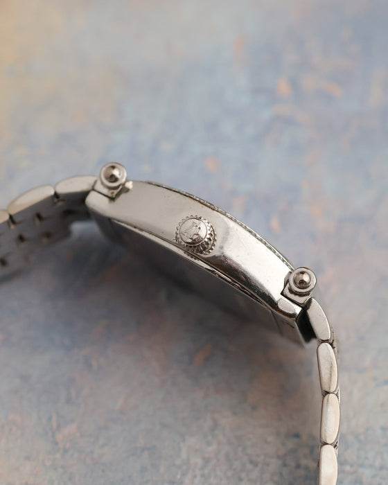 Side profile of the Audemars Piguet Carnegie showing its curved white-gold case and signed fluted AP crown.