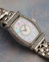Detailed view of the Audemars Piguet Carnegie showing the factory diamond-set bezel and lugs surrounding the iridescent mother-of-pearl dial.