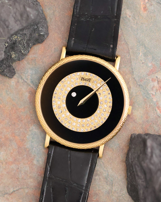 Piaget Ref. 9026 photographed with its black onyx and diamond-set mystery-hour dial in full view.