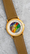 Angled view of the Blancpain Ref. 0021 showing its geometric multicoloured cloisonné enamel dial and yellow-gold case.
