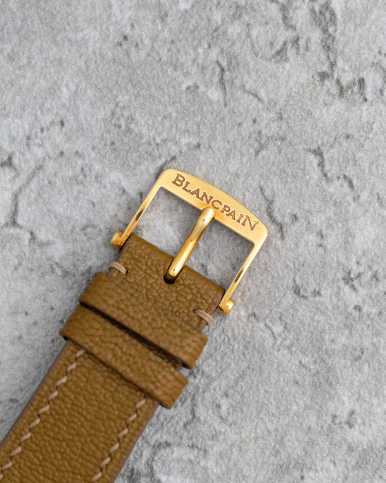 Signed Blancpain yellow-gold pin buckle fitted to the brown leather strap.