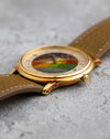 Side profile of the Blancpain Ref. 0021 showing its slim stepped yellow-gold case and cloisonné enamel dial.