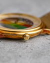 Macro photograph of the signed Blancpain crown and patinated yellow-gold case.