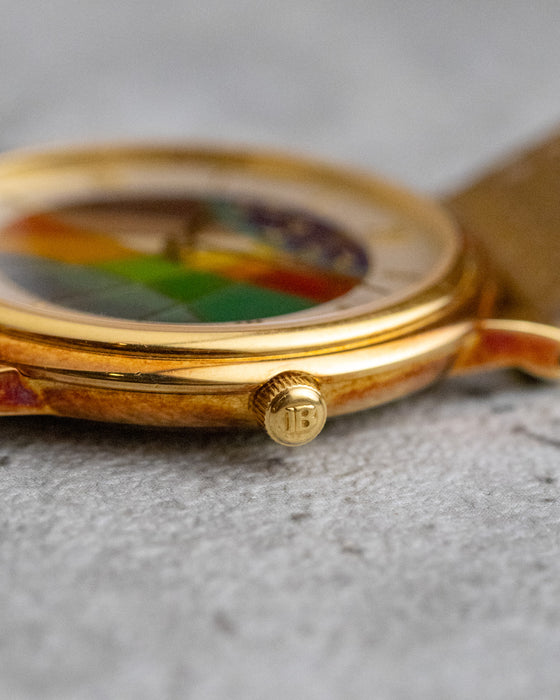 Macro photograph of the signed Blancpain crown and patinated yellow-gold case.