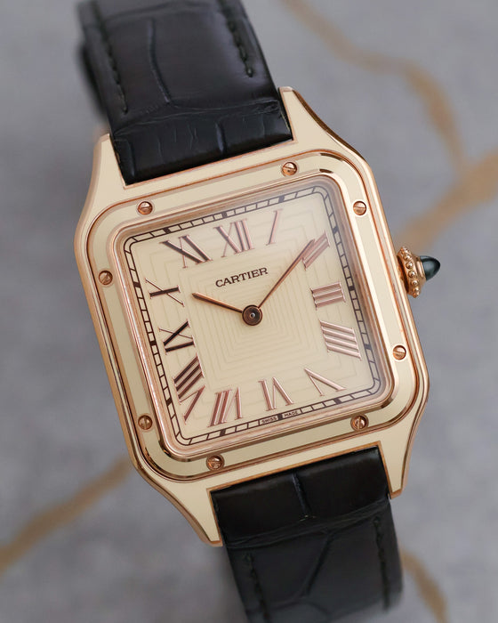 Close angled view of the Cartier Santos-Dumont WGSA0054 highlighting its applied Roman numerals and concentric square dial pattern.