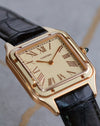 Low-angle close-up of the Cartier Santos-Dumont WGSA0054 showing the layered dial, lacquer bezel and polished rose-gold details.