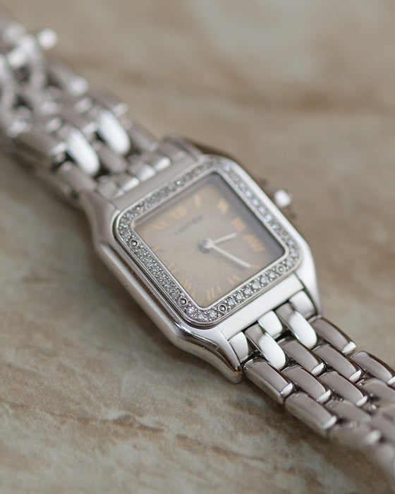 Cartier Panthère Ref. 1660 in 18K white gold with factory diamond bezel and aged silvered Roman numeral dial.