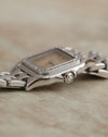 Side profile of the Cartier Panthère Ref. 1660 showing its diamond-set bezel and faceted crown.