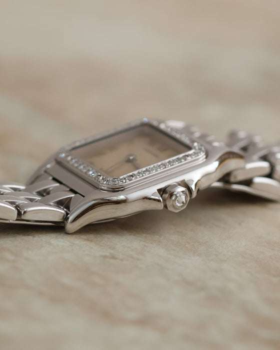 Side profile of the Cartier Panthère Ref. 1660 showing its diamond-set bezel and faceted crown.
