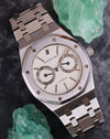 Audemars Piguet Royal Oak 25572ST photographed with green mineral specimens highlighting its white calendar dial.