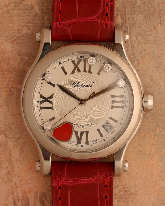 Chopard Happy Sport Happy Hearts Cortina 50th Anniversary watch with five dancing diamonds, red carnelian heart and red alligator strap.