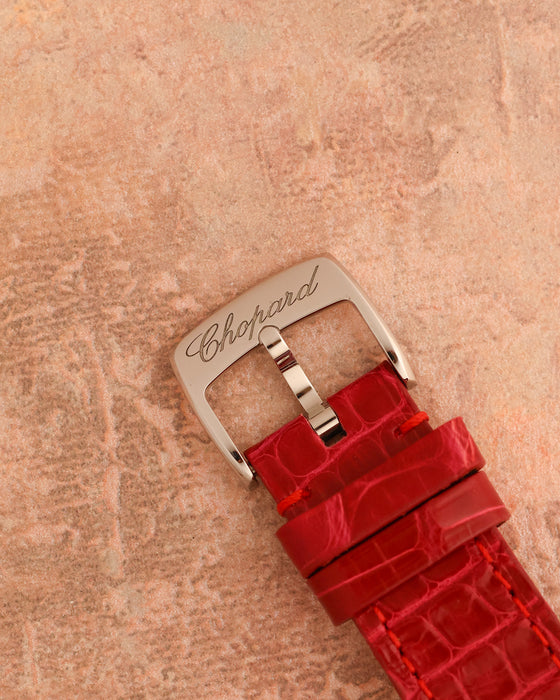 Signed Chopard stainless-steel pin buckle fitted to the original red alligator leather strap.