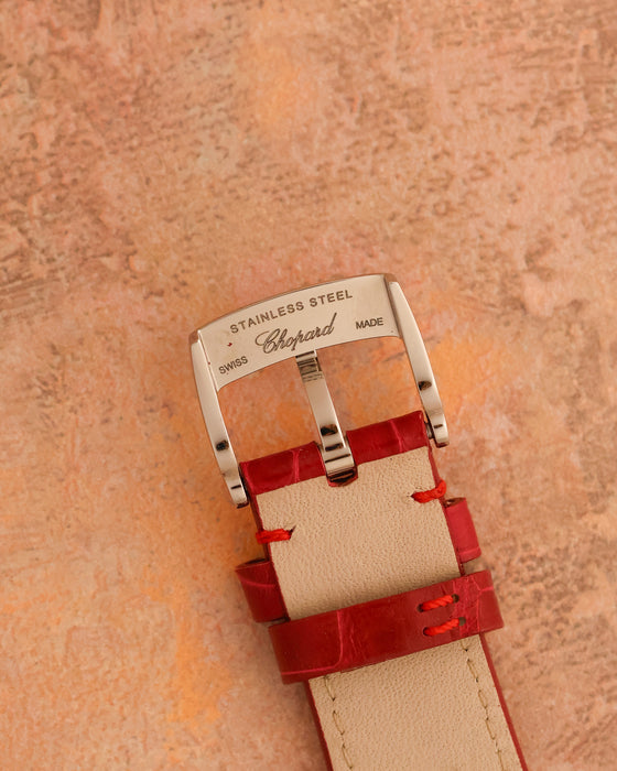 Reverse of the signed Chopard stainless-steel pin buckle and red alligator strap.