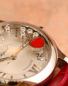 Macro view of the five dancing diamonds and red carnelian heart on the Chopard Happy Sport Cortina 50th Anniversary.