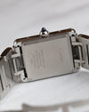 Caseback of the Cartier Tank Must WSTA0056 showing Cartier engravings, reference markings and stainless steel bracelet.