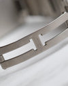 Close-up of the signed Cartier folding clasp fitted to the stainless steel bracelet.