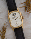 Close-up of the Arkade 103.021 showing its architectural yellow-gold case and ivory dial.