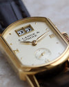 Macro view of the Arkade dial highlighting the double-window outsize date and applied gold markers.