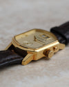 Crown-side profile of the Arkade showing its signed crown and recessed date corrector.
