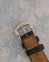 Signed and hallmarked Patek Philippe 18K white-gold pin buckle.
