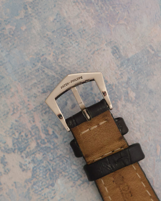 Signed and hallmarked Patek Philippe 18K white-gold pin buckle.