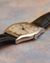 Side profile of the Patek Philippe Gondolo 5030G showing its curved tonneau case and signed crown.