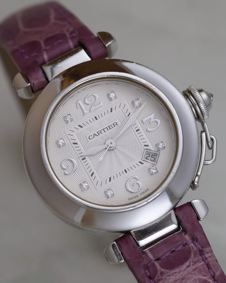 Angled view of the Cartier Pasha 2398 showing its 32 mm white-gold case, diamond hour markers and date display.
