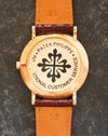 Rose-gold caseback of the Patek Philippe 5022R with Patek Philippe International Customer Service sticker.