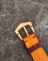 Signed Patek Philippe 18K rose-gold pin buckle fitted to the burgundy leather strap.