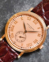 Angled dial close-up showing the intricate guilloché pattern and applied rose-gold Roman numerals of the Patek Philippe 5022R.