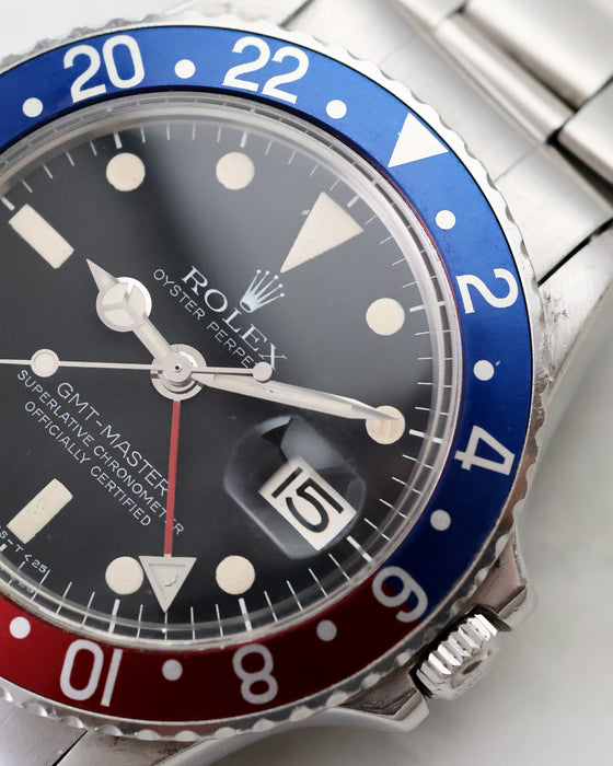 Angled macro of Rolex GMT-Master 1675 Mark 2 dial, date and Pepsi bezel.