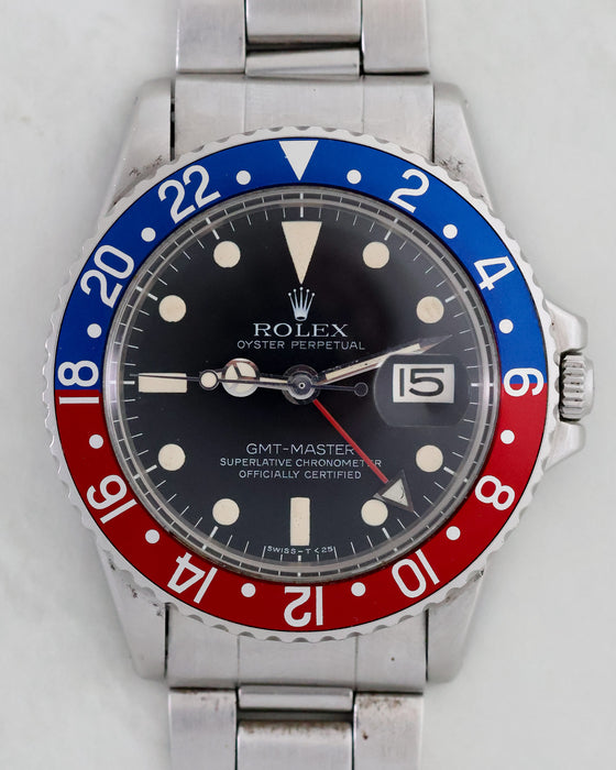Front view of vintage Rolex GMT-Master 1675 with Pepsi bezel and folded Oyster bracelet.