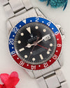 Angled view of Rolex GMT-Master 1675 with matte dial and red-and-blue bezel.