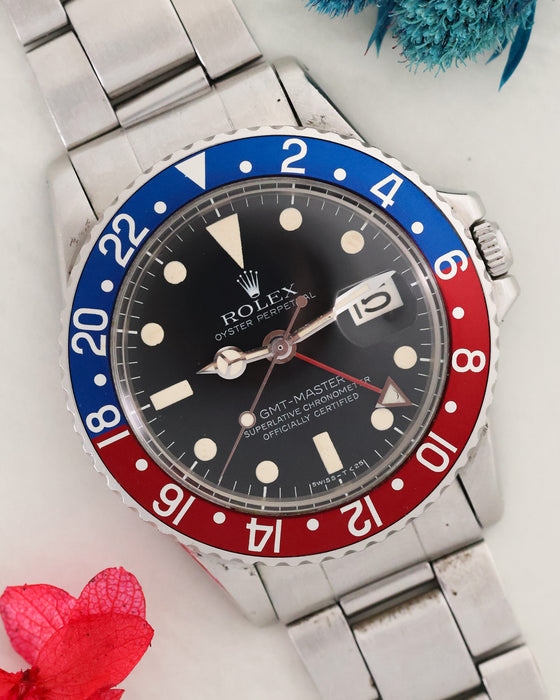 Angled view of Rolex GMT-Master 1675 with matte dial and red-and-blue bezel.