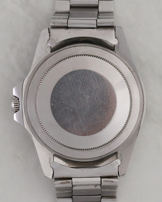 Caseback of Rolex GMT-Master 1675 with folded bracelet and stamped 358 end links.