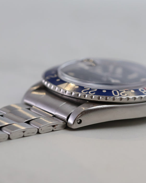 Side view highlighting the vintage Rolex GMT-Master 1675 case and folded bracelet construction.