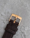 Original Omega 18K rose-gold pin buckle fitted to the brown leather strap.
