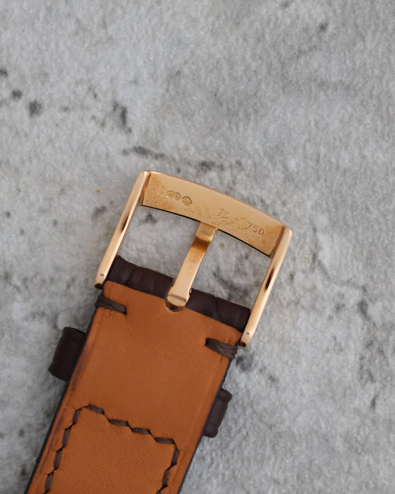 Reverse of the original Omega pin buckle showing its 750 gold hallmark.