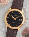 Omega De Ville Prestige in 18K rose gold with black dial, applied gold markers and date at 3 o'clock.
